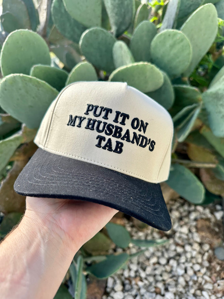 Put It On My Husbands Tab Trucker Hat
