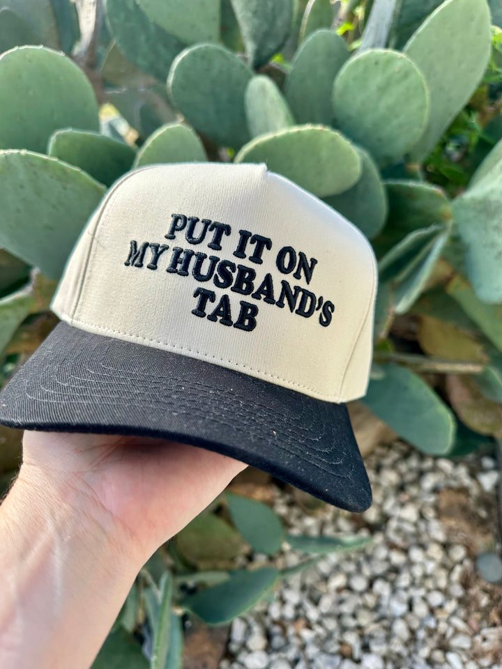 Put It On My Husbands Tab Trucker Hat